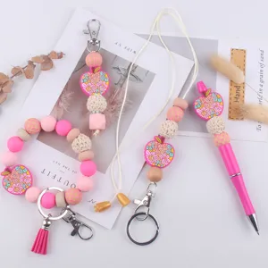 Pink silicone bead keychain set with lanyard and ballpoint pen, cute teacher gift accessory.