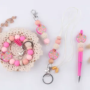 Cute teacher silicone bead keychain set with lanyard and matching pen for daily use.