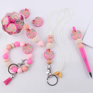 Silicone bead keychain set with cute apple charms and lanyard, perfect for DIY crafting and daily use.