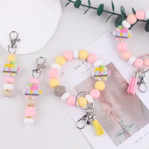Silikon Perlen Armband Schlüsselanhänger Set mit süßen Apfel Anhängern und Quasten.