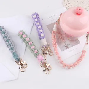 Handmade woven water bottle strap, colorful macrame cup sling with secure metal clasps.