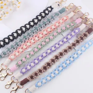 Handmade woven water bottle strap with cute flower patterns, colorful cotton macrame handle.