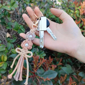 Handgemachte geflochtene Gänseblümchen Perle Schlüsselanhänger Baumwollseil Tasche Anhänger.