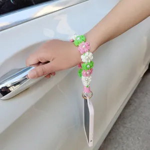 Handgemachte gehäkelte Blumen Handyschlaufe Detail, bunte Gänseblümchen Armschlaufe mit Perlen.