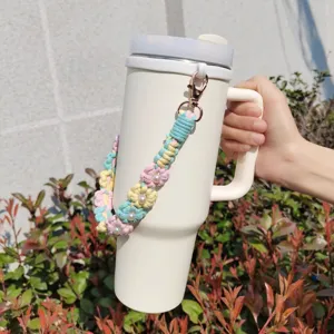 Handmade crochet daisy flower pearl water bottle strap for daily outdoor travel and decoration.