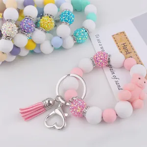 Cute silicone beaded keychain wristlet with 3D cartoon bear and pink tassel for keys.