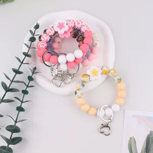Colorful silicone beaded wristlet keychain with floral charm for daily use and accessories