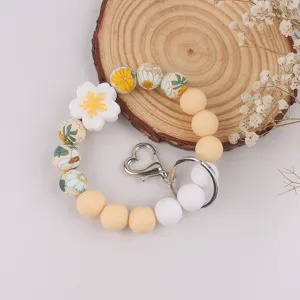 Silicone beaded keychain bracelet with floral charms and heart metal clasp for women
