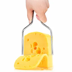 Close-up detail showing a stainless steel cheese slicer wire cutting a block of cheese
