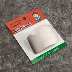 Detailed close-up of a stainless steel finger guard for safe cooking in retail packaging