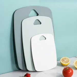 Set of 3 colorful plastic cutting boards in various sizes for kitchen use
