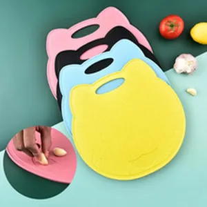 Detail of cat head shaped colorful cutting boards for home kitchen vegetable preparation