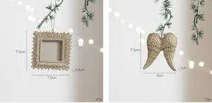 Detailaufnahme von Champagner Glitzer Harz Weihnachten Fotorahmen und Engelsflügeln.