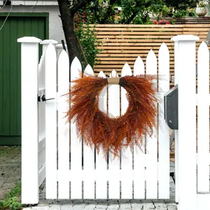 Detailed close-up view of the artificial brown fern hanging wreath, perfect for wall decoration.