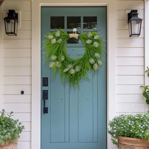 Detailed view of the artificial green plant spring wreath hanging on the front door.