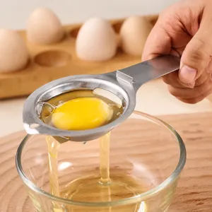 Stainless steel egg separator kitchen tool for separating egg whites and yolks easily.