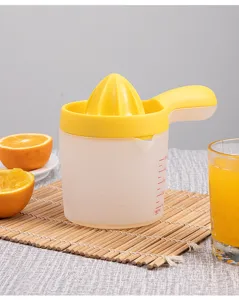 Plastic manual citrus juicer with measuring scale and handle for fresh orange juice prep.