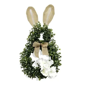 Easter eucalyptus bunny wreath with burlap ears and bow, front door hanging spring decoration.