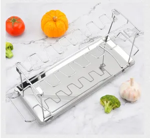 Stainless steel foldable chicken leg grilling rack with 14 slots, perfect BBQ cooking tool.