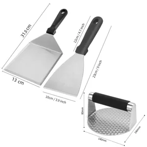 Stainless steel BBQ grill tools set with spatula turners and burger press for outdoor cooking.