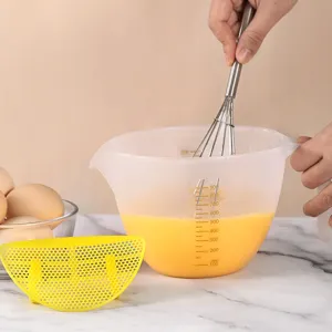 Japanese style plastic mixing bowl with scale and egg separator for baking and cooking.