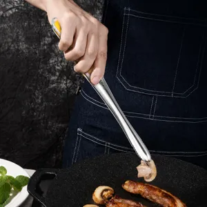 Pince alimentaire en acier inoxydable pour barbecue, cuisine, steak avec poignée antidérapante.