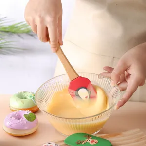 Silicone spatula with wooden handle for baking, cake cream mixing and jam scraping.