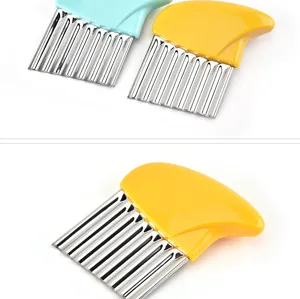 Stainless steel potato crinkle cutter detail, sharp wave knife for kitchen vegetable slicing.