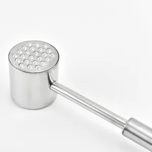 Stainless steel meat tenderizer hammer with textured spike side for kitchen steak cooking.