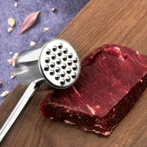 Stainless steel meat tenderizer hammer for kitchen use, durable steak mallet tool for cooking.