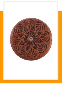 Wooden UFO bread lame scoring tool with carved mandala pattern for artisan baguette baking.