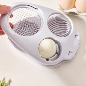 Multifunctional egg slicer 3-in-1 kitchen tool for boiled eggs, fruit, and easy food prep.