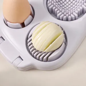Multifunctional egg slicer for kitchen, durable plastic egg cutter tool with slicing blades.
