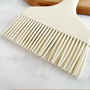 Silicone basting brush detail shot, dense flexible bristles for kitchen and barbecue cooking.