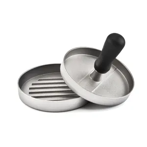 Close up of the aluminum burger press with non-stick ribbed base and ergonomic black handle.