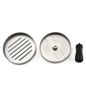 Detailed view of aluminum hamburger press components including ridged base and handle.