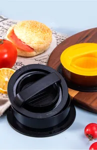 Plastic burger press detail showing ergonomic handle and non-stick patty mold design.