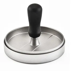 Detailed view of the aluminum hamburger press with a comfortable black handle for kitchen cooking.