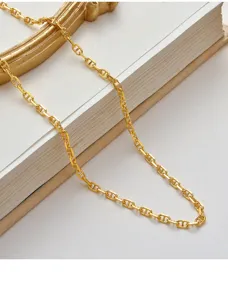 Gold chunky pig nose chain necklace, stylish link detail close-up for trendy women and girls.
