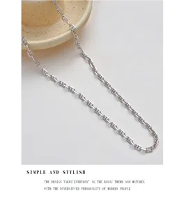 Close-up detail view of silver pig nose chain necklace with minimalist chic design for daily wear.