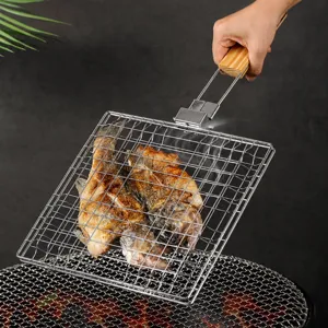 Stainless steel foldable fish grilling basket with wooden handle for outdoor BBQ cooking tool.