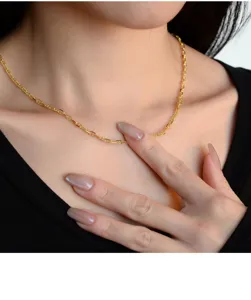 Close-up detail of the trendy sterling silver anchor link chain necklace showing texture.