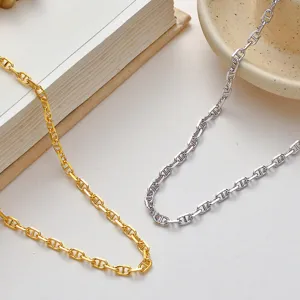 Sterling silver and gold plated anchor chain necklace, trendy cool style fashion jewelry accessory.