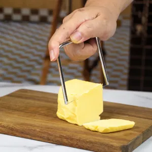 Stainless steel butter cheese slicer kitchen gadget for cutting butter blocks easily.