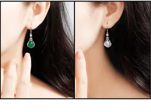 Nahaufnahme von silbernen Jade-Ohrringen mit feiner Handwerkskunst und zwei Farboptionen.