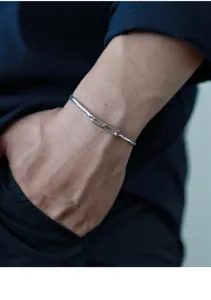 Detail shot of S925 sterling silver soft snake bone chain bracelet with adjustable clasp.