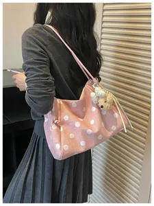Minimalist pink polka dot shoulder bag, casual large capacity summer commuter tote.