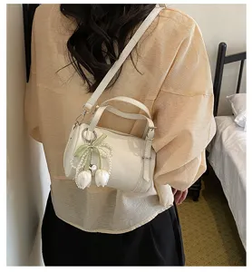 Stylish chic white pillow shoulder bag for women, trendy crossbody purse with tulip pendant