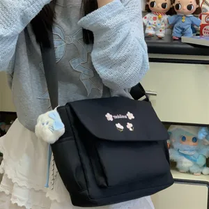 Black canvas messenger bag with flap cover, cute embroidery, spacious daily commuting crossbody.
