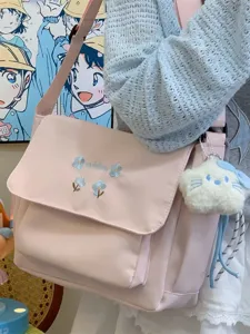 Pink canvas shoulder bag for women, cute floral embroidery large commuter messenger tote.